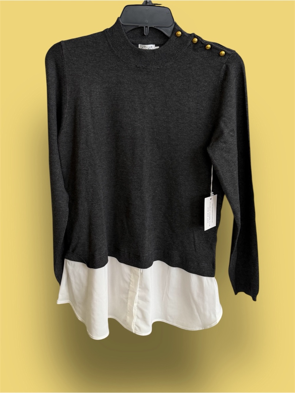 Cielo Black Sweater with White Shirt Hem and Gold Button Detail